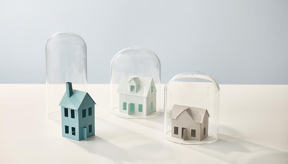Houses placed under glass container. 